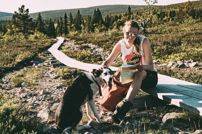 Mountain walk with husky companion