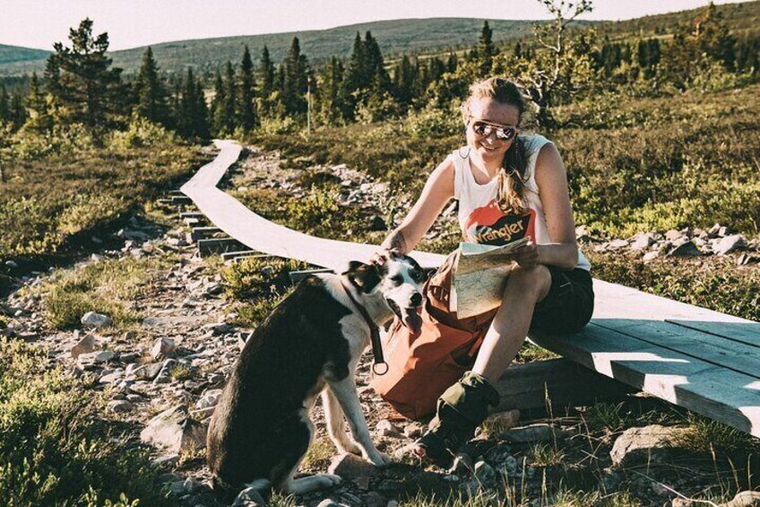 Mountain walk with husky companion