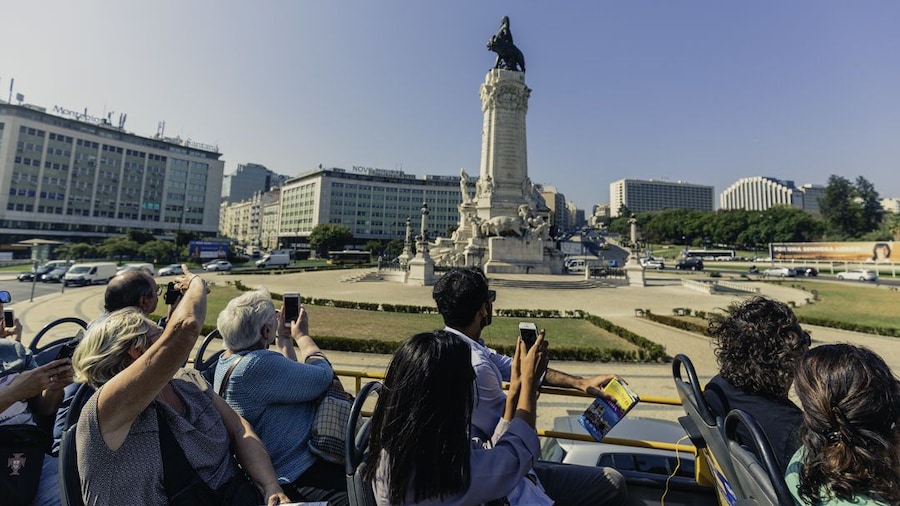 Double decker bus tour going through the Lisbon District