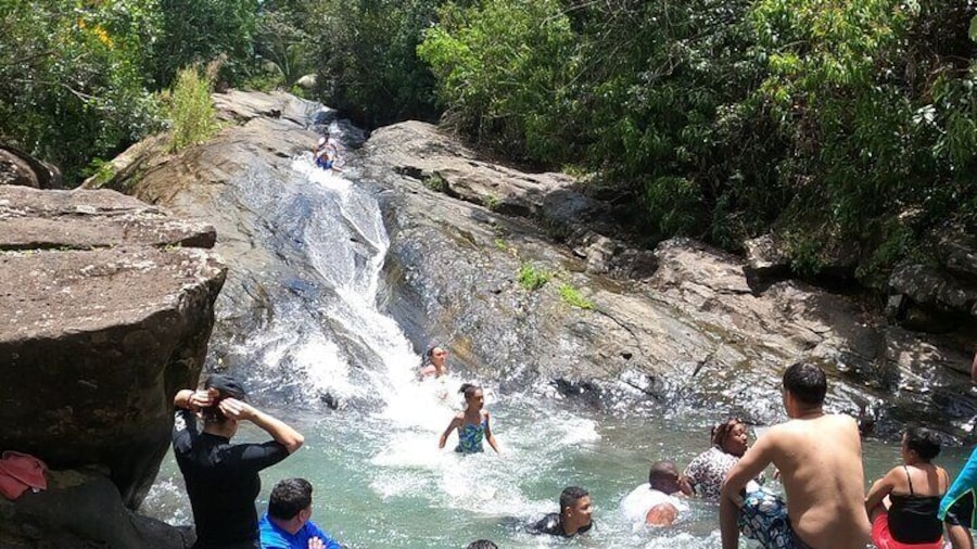 El Yunque Rainforest Natural Waterslide on a sunny Puerto Rico Day