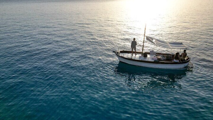 Boat Sunset Aperitif Tour in Tavolara and Molara