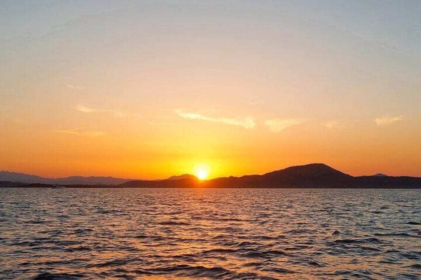 Boat Sunset Aperitif Tour in Tavolara and Molara