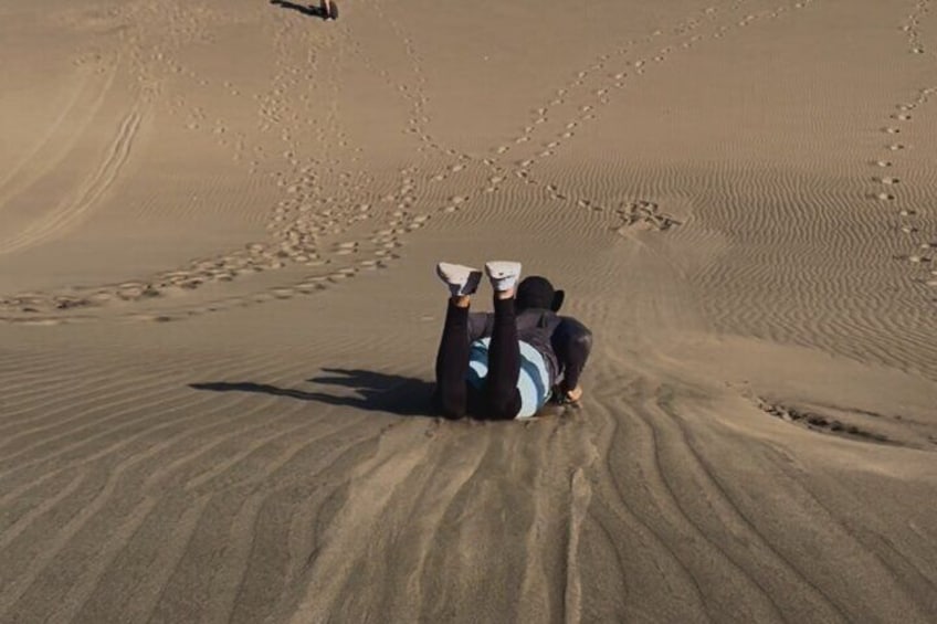 Sandboarding in dunes
