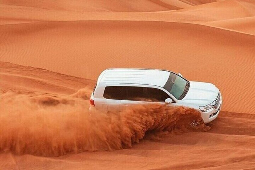 Dubai Red Dune Adventure: Dune Bashing, Camel Ride and BBQ
