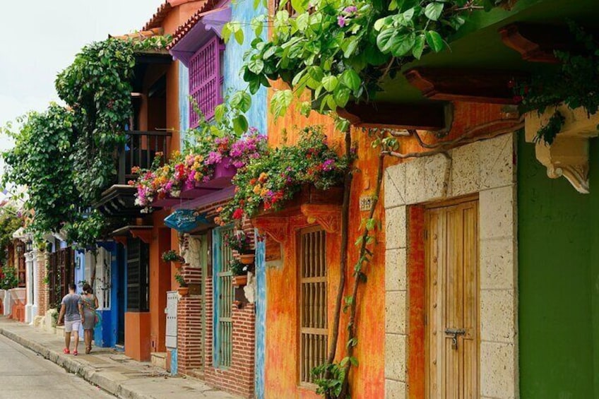 One of the many colorful brick homes and scenic neighborhoods we will walk around in the evening in Cartagena during your pub the crawl.