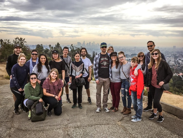 Hiking group with a view of the city in the background in LA