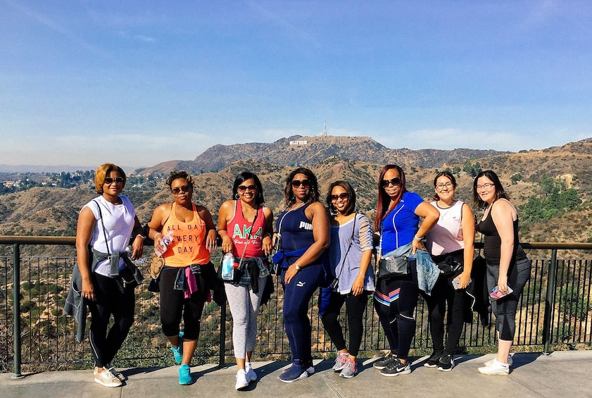 Hiking group with the Hollywood Sign in the background in LA
