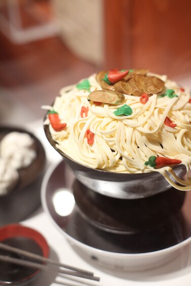 Show item 4 of 9. Pot of noodles made of chocolate at Art Of Chocolate Museum in Hong Kong