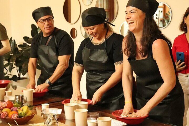 Tourists enjoying the kneading process of pandebons
