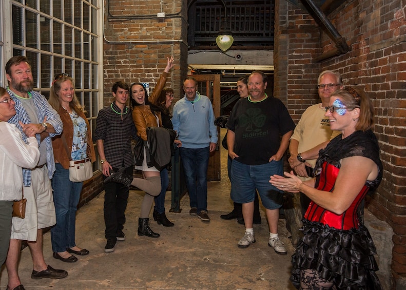 Costumed guide leading a haunted tour in Denver