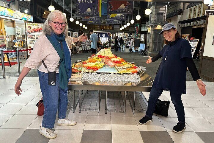 Guests enjoying a sushi-themed display inside the Shimizu Sushi Museum — a perfect photo opportunity to kick off the cultural journey!