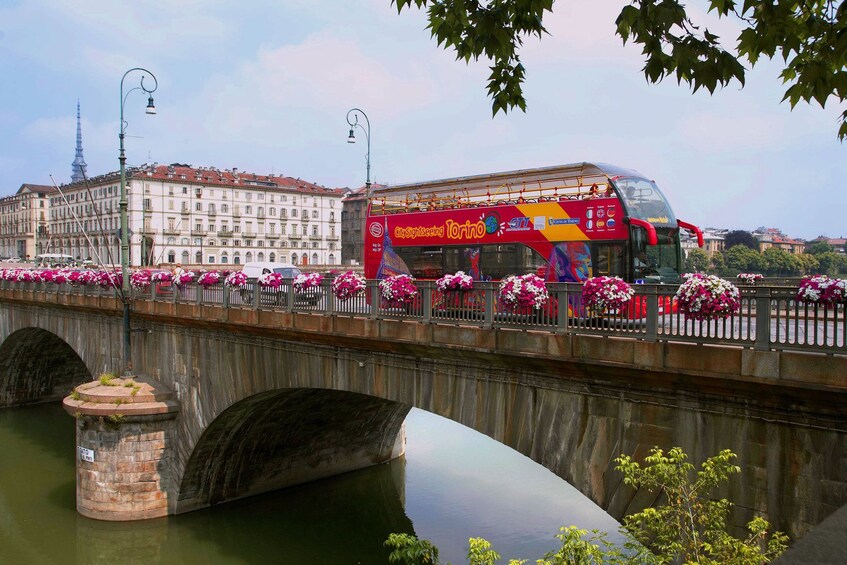 Hop-on hop-off bus on a bridge in Torino