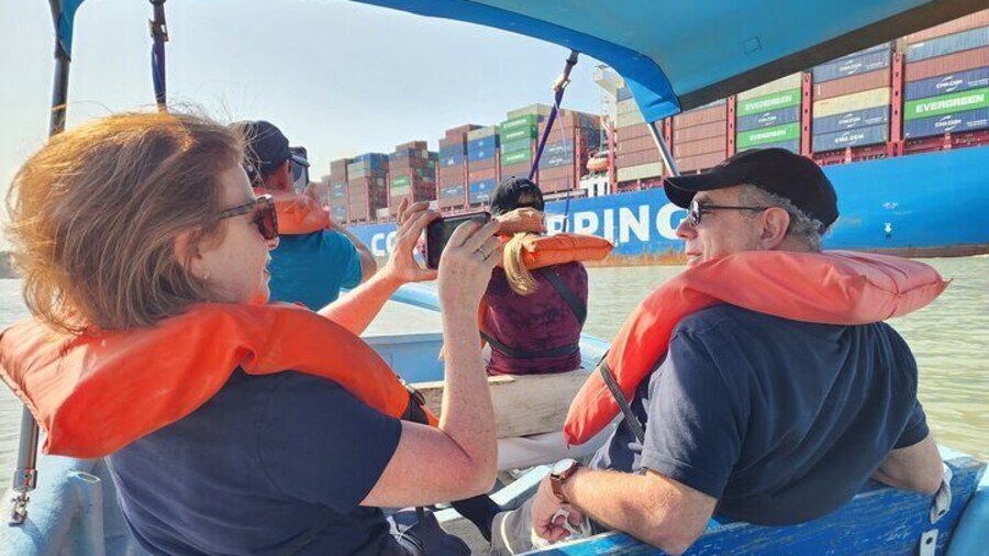 Let's pass right next to massive ships transiting the Panama Canal!