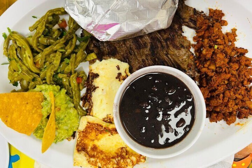 Steak, Chorizo, Fried Cheese, Guacamole, Cactus Salad and Black Beans with Fresh Handmade Corn Tortillas