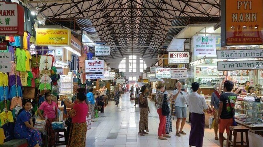 Discover local treasures and souvenirs inside historic Bogyoke Market