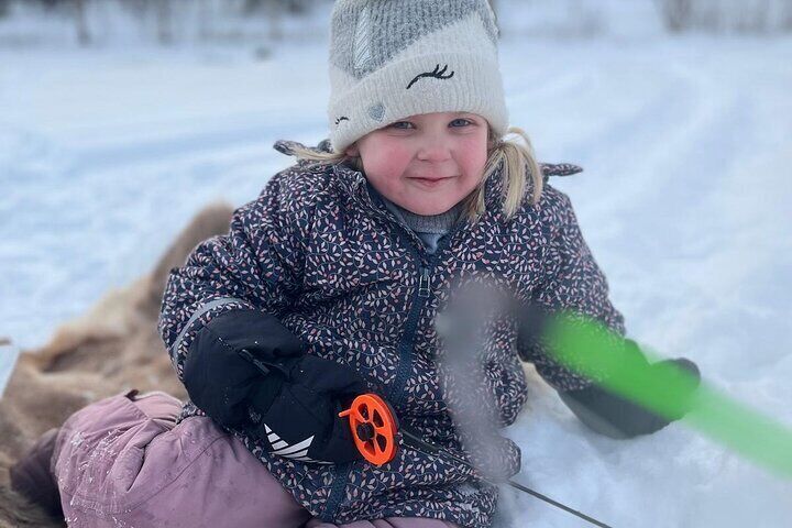 Lapland Winter Adventure Snowmobiling and Ice Fishing Experience