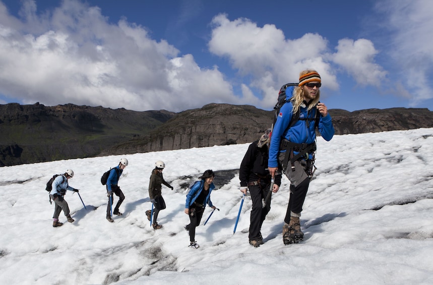 Group treks up snowy hill in Iceland