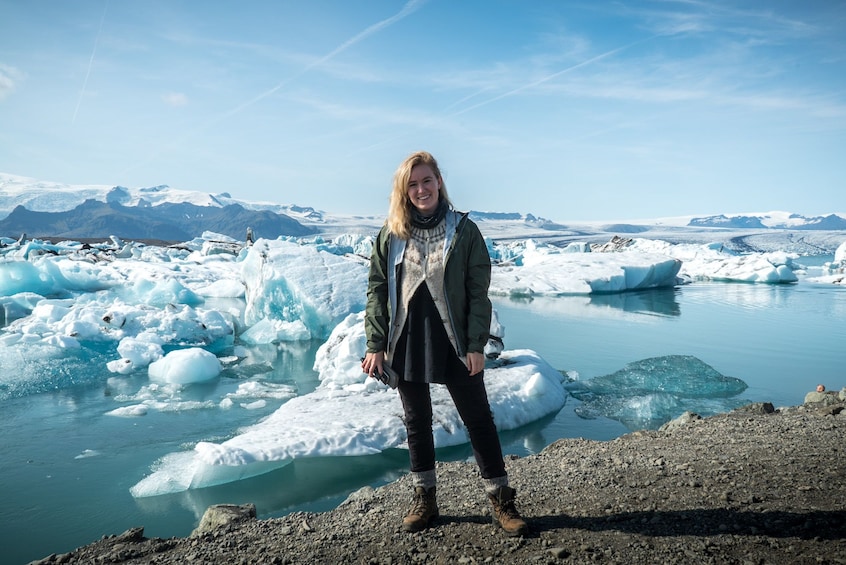 Woman poses at Jökulsárlón Glacier Lake in Iceland