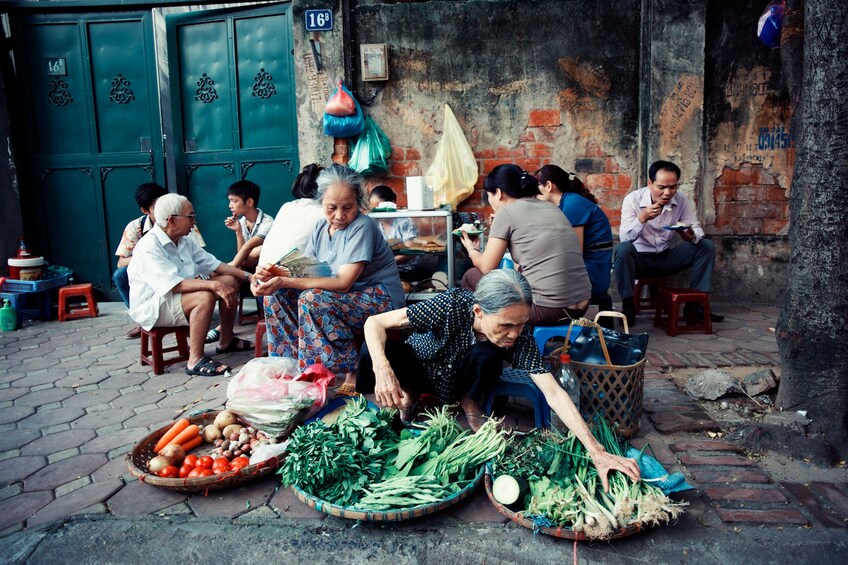 Local woman selling vegetables in Hanoi City 