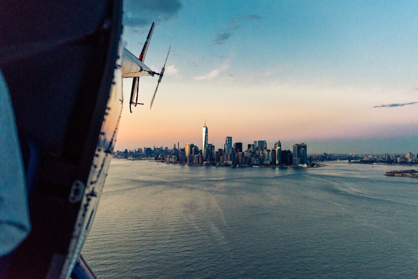 Aerial sunset views of NYC from a helicopter 