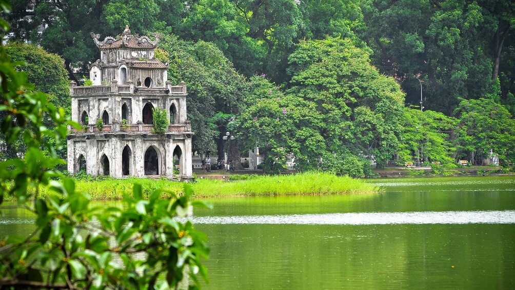 Stone tower in the middle of a lake in Hanoi