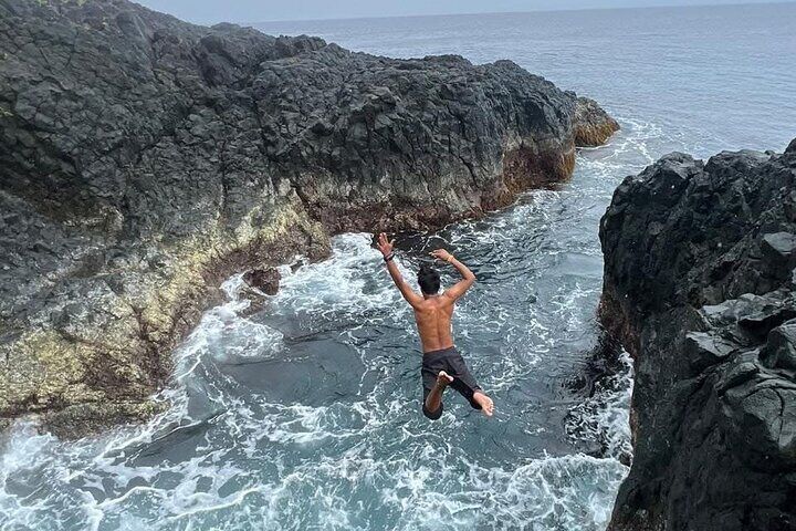 Hagukan Diving Spot: This is a unique rock formation where the waves from the Pacific Ocean crash against the cliffs, creating a turbulent, deep pool. 