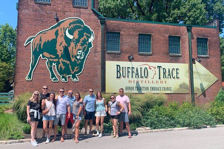 Group poses in front of Buffalo Trace Distillery