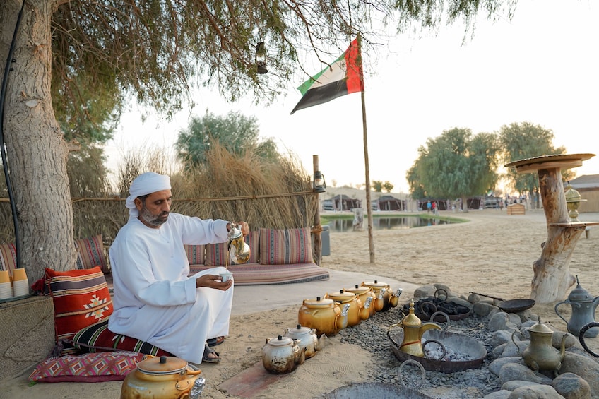 Red Dunes Quad Bike, Sandsurf, Camels & Arabian Buffet Dinner at Al Khayma