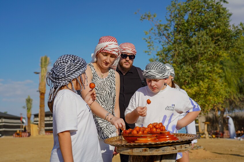 Red Dunes Quad Bike, Sandsurf, Camels & Arabian Buffet Dinner at Al Khayma