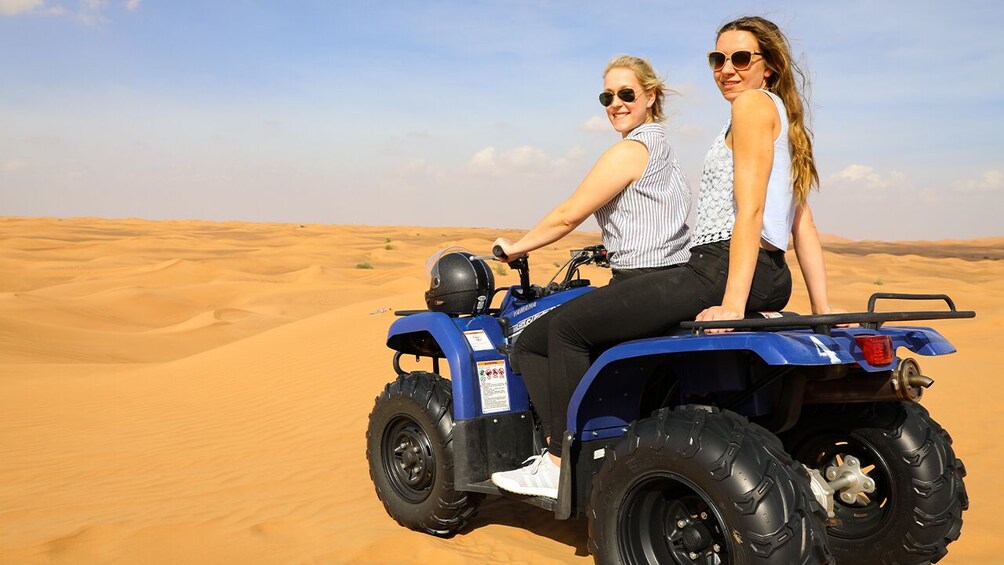  Red Dunes by Quad Bike, Camel Ride, Sandboarding and BBQ