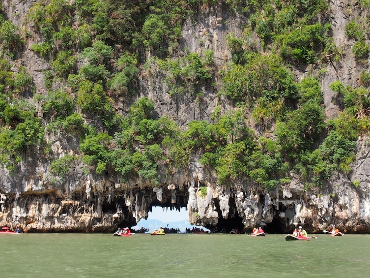 Rafting group going through caves on Thalu Island