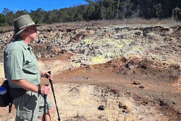 Surveying the steaming mineral deposits at the Sulphur Banks