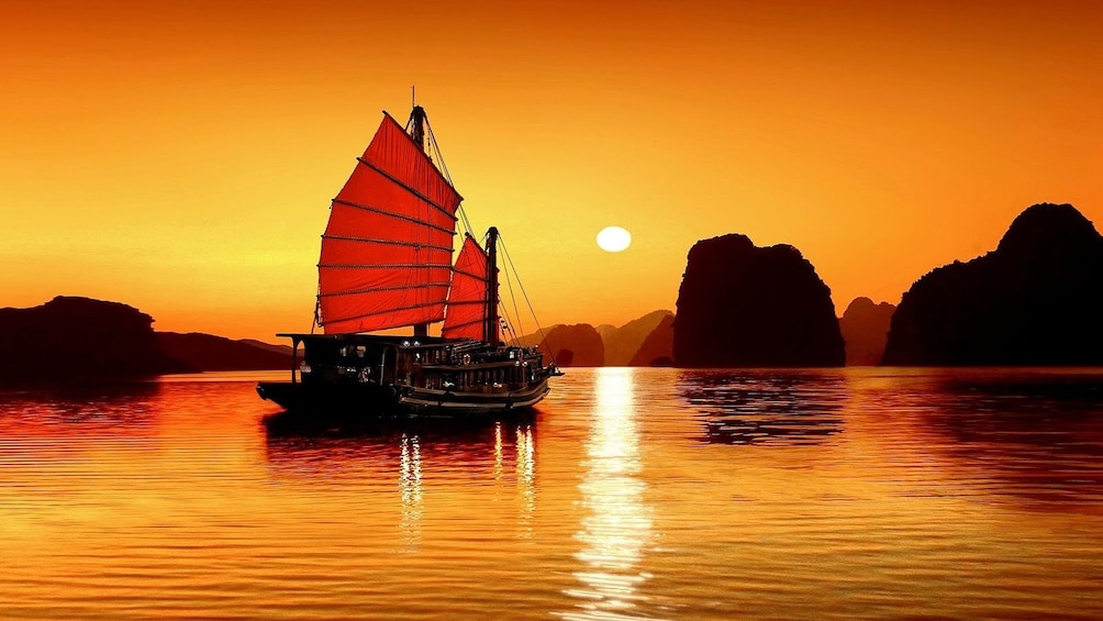 Sailboat in Halong Bay at sunset