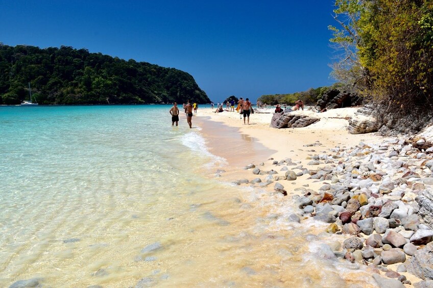 Beachgoers on an island in Thailand