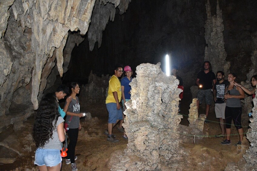Group inside a cave near Cheow Lan Lake in Thailand