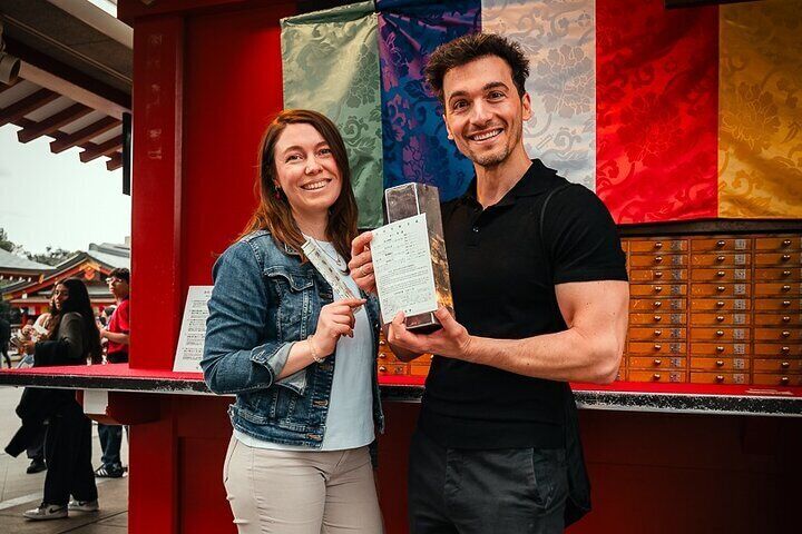 Walking through the serene path lined with countless red torii gates.