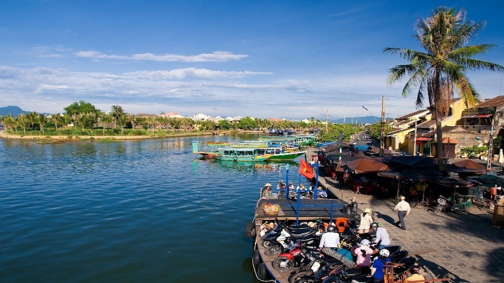Docked boats on the Thu Bon River in Vietnam