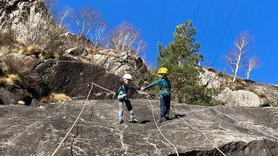 Family rock climbing near Locarno