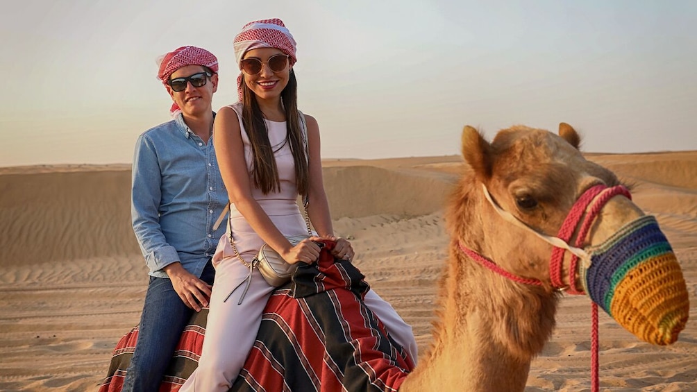 Dubai Morning Quad Bike Tour with Sandboarding & Camel Ride