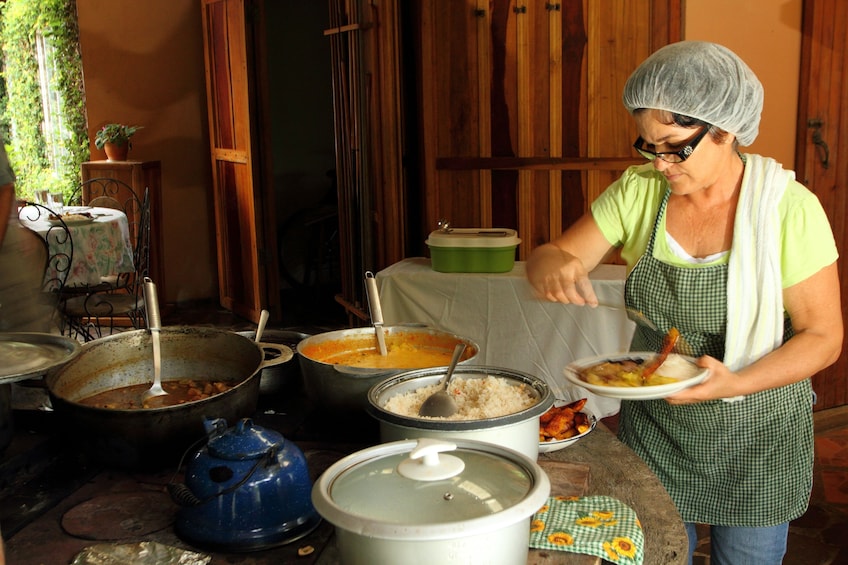 Woman preparing a plate of food in Costa Rica