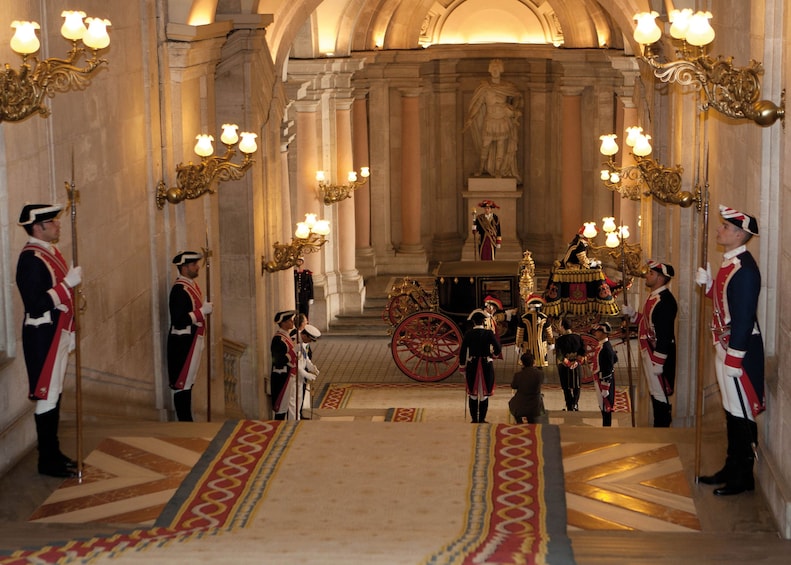 Guards lined against the halls inside the Royal Palace of Madrid