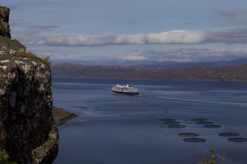Landscape views of a boat in the water on the Isle of Skye in Scotland