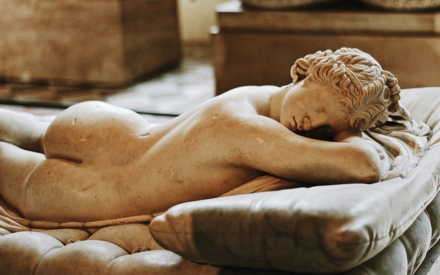 Reclining marble statue