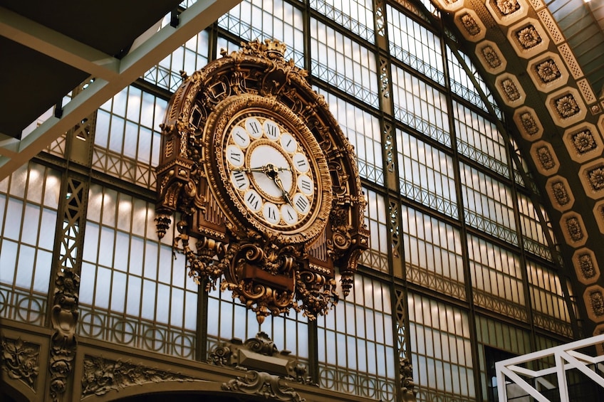 Close view of the detailed clock inside the Orsay Museum 