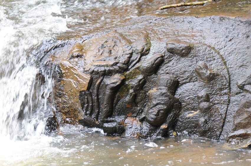 Rock carvings in a river in Siem Reap
