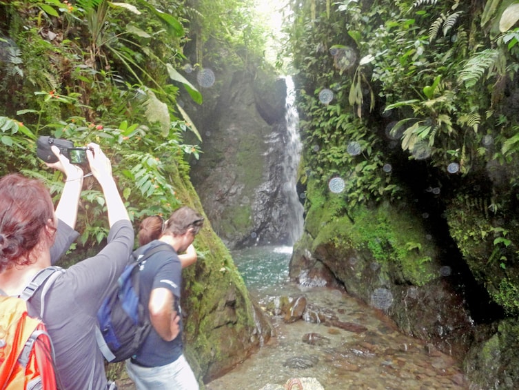 Group waterfall hiking at the Mindo Cloud Forest in Ecuador 