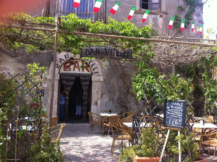 Show item 5 of 6. In front of Bar Vitelli in Italy