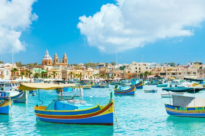Boats in the water around  Marsaxlokk, Malta