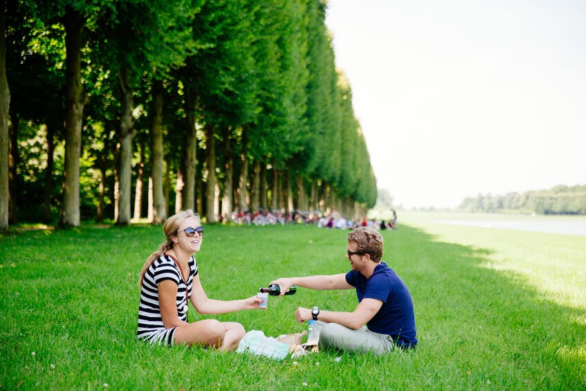 Couple enjoying a picnic in a park in Paris