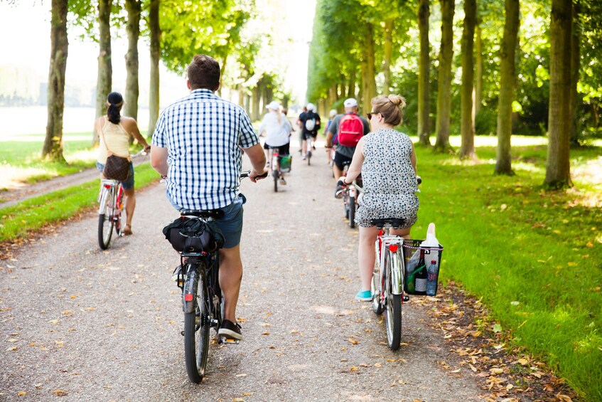 Biking group riding through a park in Paris